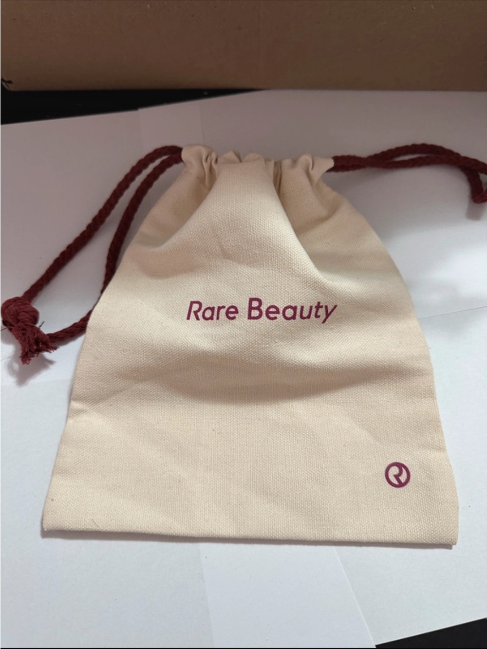 Rare Beauty Cream Drawstring Pouch with Plum Logo and Cords